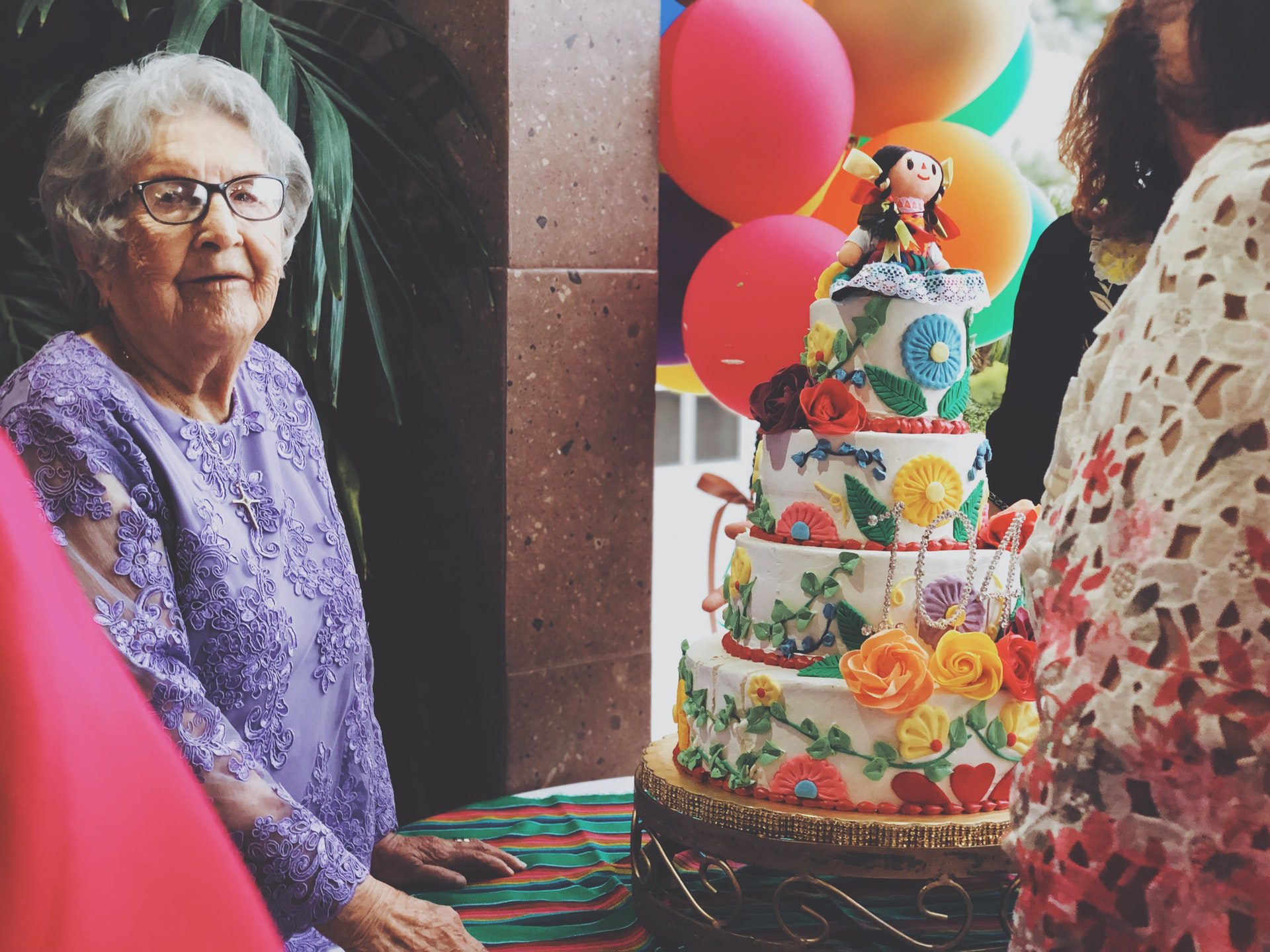 Senior woman with a birthday cake